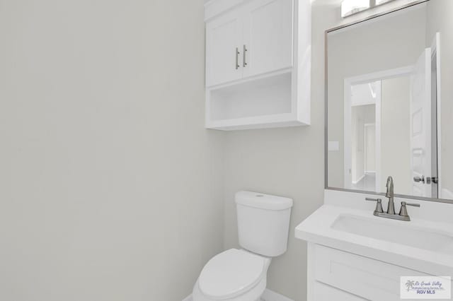 4698 Kalinga Ln, Brownsville, TX 78521 - half bath with toilet, vanity, and baseboards