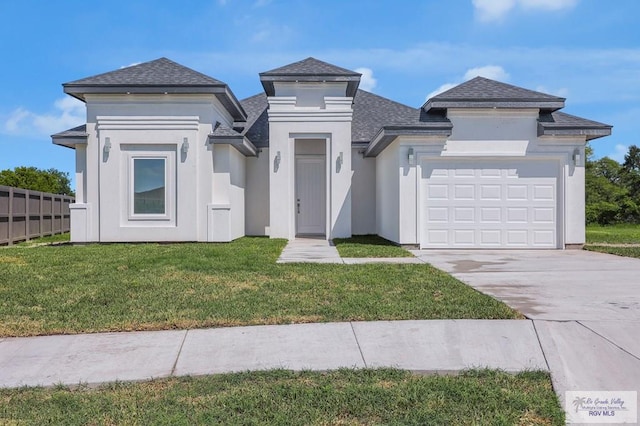 4698 Kalinga Ln, Brownsville, TX 78521 - view of front facade featuring roof with shingles, driveway, and an attached garage