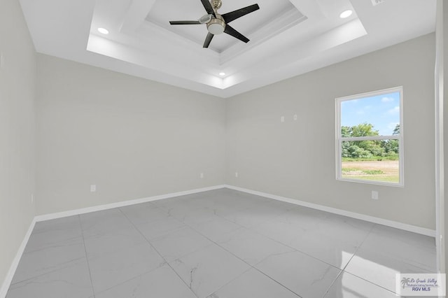 4698 Kalinga Ln, Brownsville, TX 78521 - unfurnished room featuring marble look tile flooring, a tray ceiling, baseboards, ceiling fan, and recessed lighting