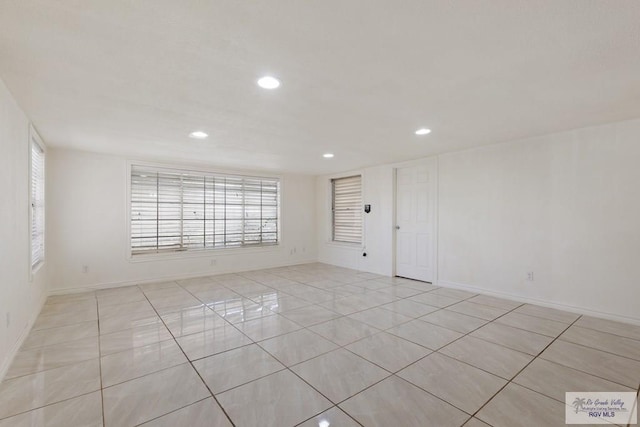 spare room with light tile patterned floors