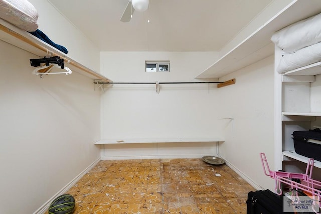 spacious closet with ceiling fan