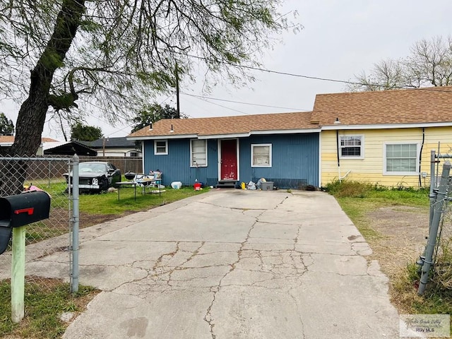 single story home featuring a front yard