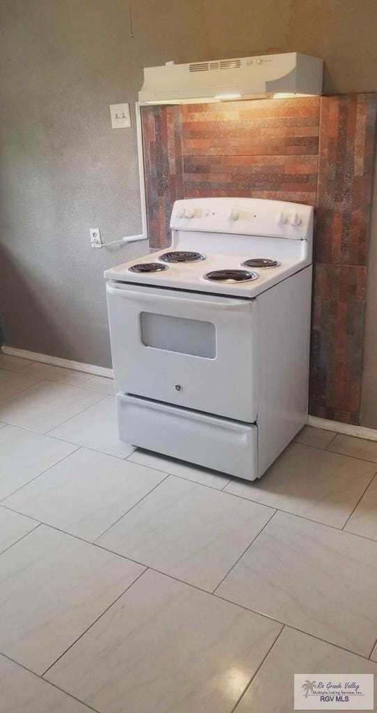 kitchen featuring white electric stove and light tile patterned floors