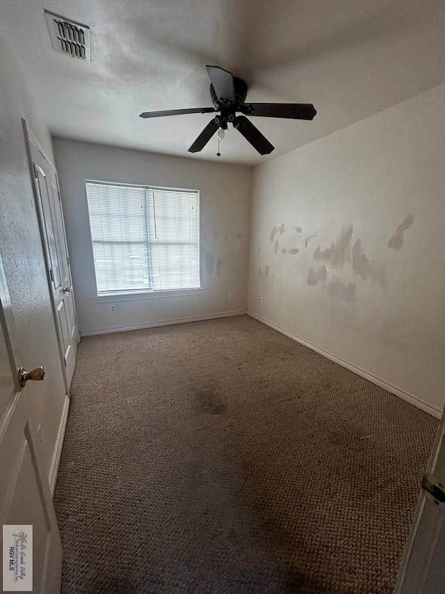 carpeted empty room with ceiling fan