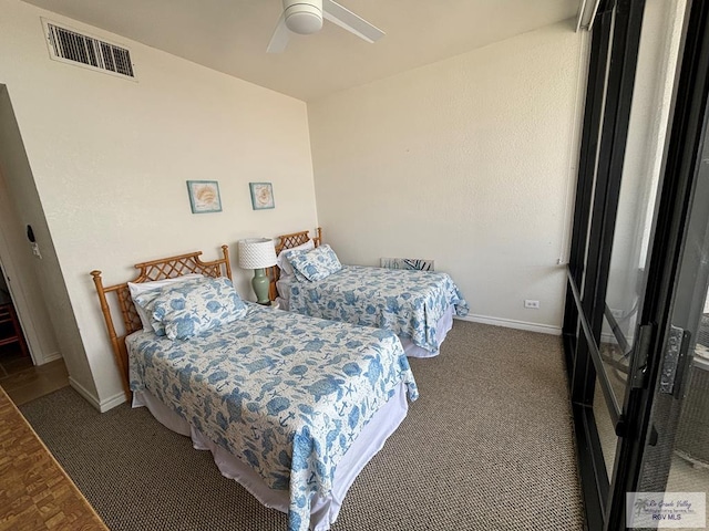 carpeted bedroom featuring ceiling fan