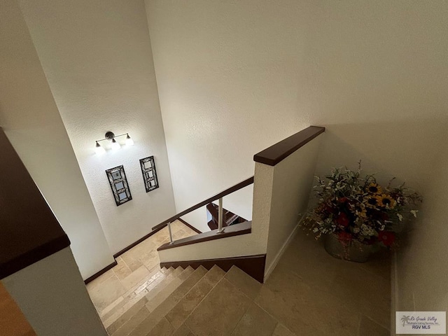 staircase featuring tile patterned floors