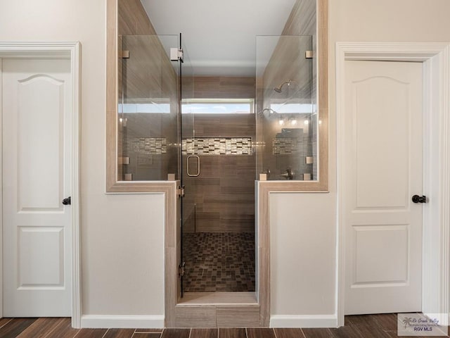 23756 Richmond Cir, Harlingen, TX 78552 - full bath featuring a shower stall and wood finished floors