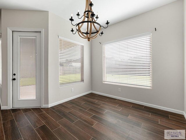 23756 Richmond Cir, Harlingen, TX 78552 - empty room with a chandelier and wood finish floors