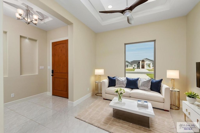 1902 Thacker Ln, Harlingen, TX 78552 - living room with a raised ceiling, a ceiling fan, and a chandelier