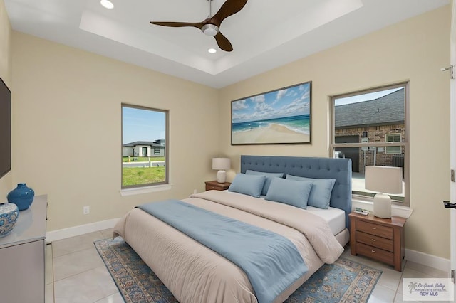 1902 Thacker Ln, Harlingen, TX 78552 - bedroom with a tray ceiling, recessed lighting, light tile patterned floors, and a ceiling fan