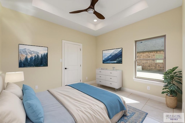 1902 Thacker Ln, Harlingen, TX 78552 - bedroom with a raised ceiling, light tile patterned floors, recessed lighting, and a ceiling fan