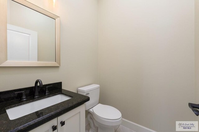 1902 Thacker Ln, Harlingen, TX 78552 - half bath with vanity and tile patterned flooring