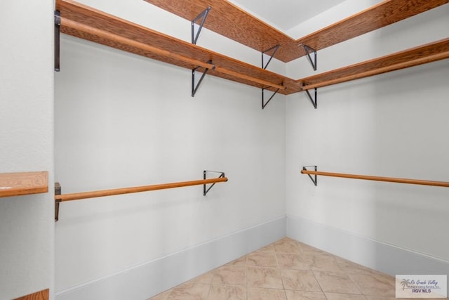 201 W Capricorn Dr, South Padre Island, TX 78597 - spacious closet with light tile patterned floors