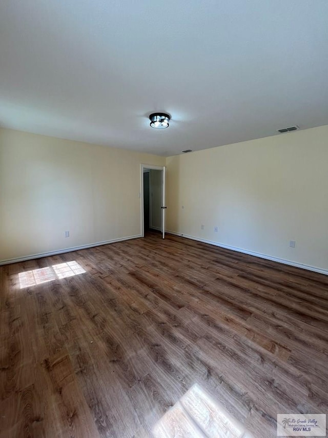 empty room featuring hardwood / wood-style flooring