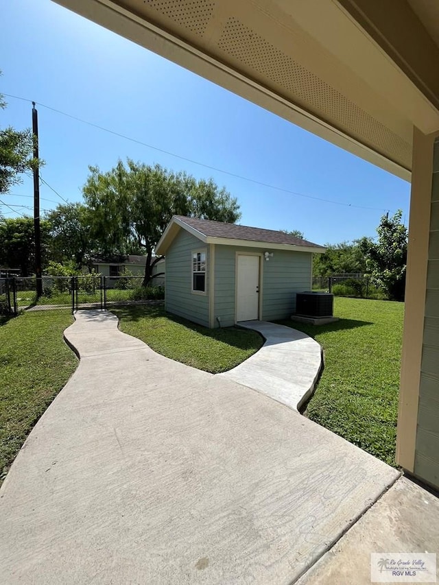 exterior space featuring cooling unit and an outdoor structure