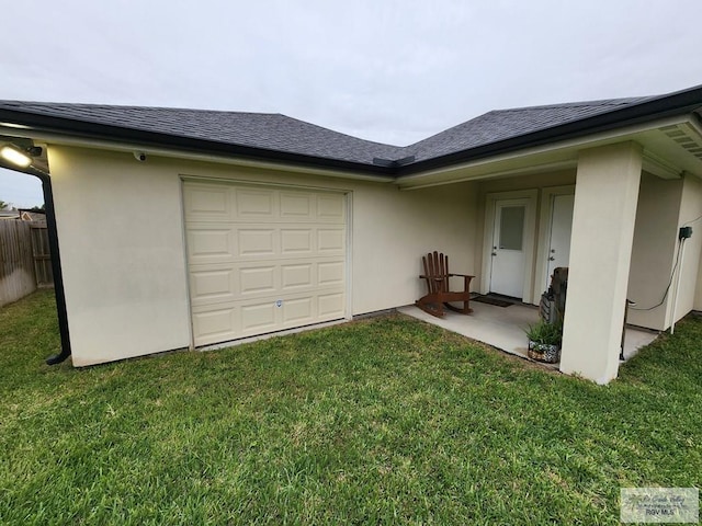 exterior space featuring a patio area and a lawn