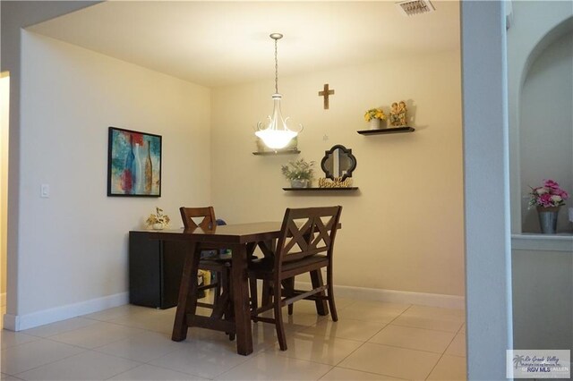 dining area with light tile patterned floors