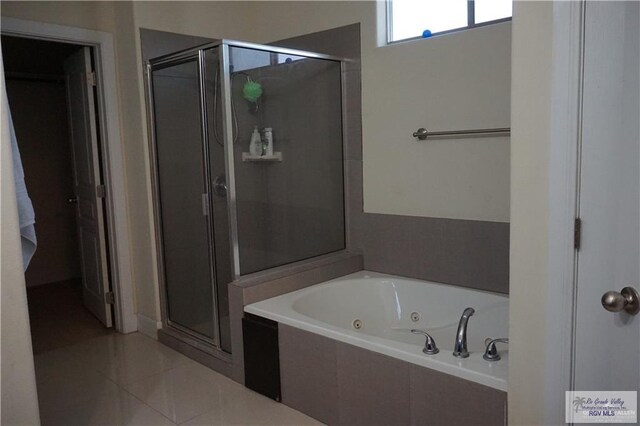 bathroom featuring separate shower and tub and tile patterned flooring