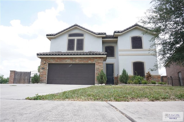 mediterranean / spanish-style house featuring a garage