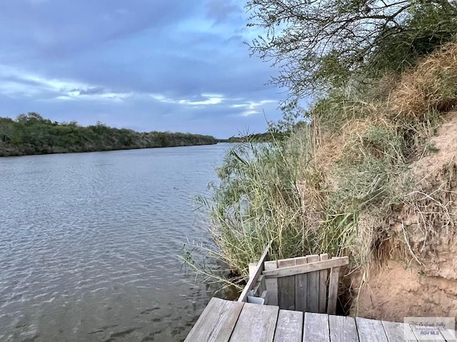 dock area featuring a water view