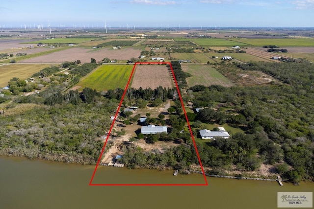 drone / aerial view featuring a water view and a rural view