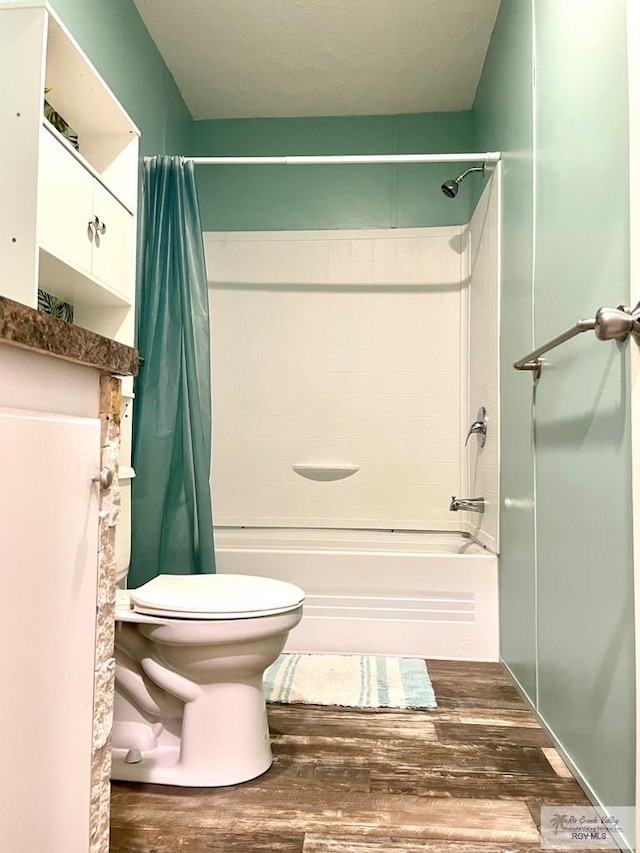 bathroom with toilet, shower / bathtub combination with curtain, and hardwood / wood-style flooring