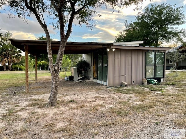 view of outdoor structure at dusk