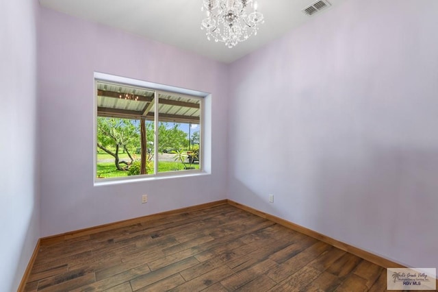 25096 Rabb Rd, La Feria, TX 78559 - empty room with a chandelier and hardwood / wood-style floors