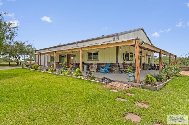 25096 Rabb Rd, La Feria, TX 78559 - back of property with a lawn and a patio