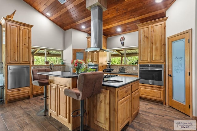 25096 Rabb Rd, La Feria, TX 78559 - kitchen featuring stainless steel appliances, island range hood, wooden ceiling, a kitchen island with sink, and tasteful backsplash