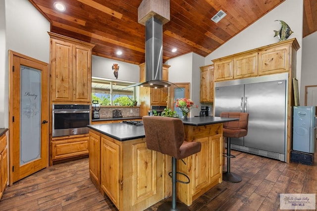 25096 Rabb Rd, La Feria, TX 78559 - kitchen with appliances with stainless steel finishes, extractor fan, dark countertops, wooden ceiling, and a kitchen island