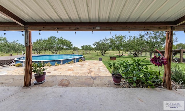 25096 Rabb Rd, La Feria, TX 78559 - swimming pool with a patio and a yard