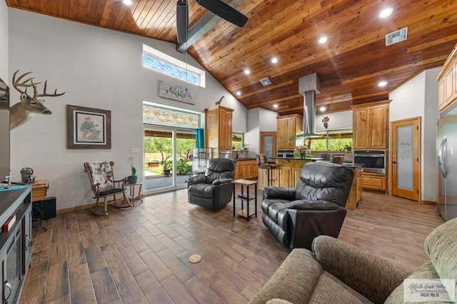 25096 Rabb Rd, La Feria, TX 78559 - living area with dark wood-type flooring, healthy amount of natural light, a wood ceiling with exposed beams, recessed lighting, and high vaulted ceiling
