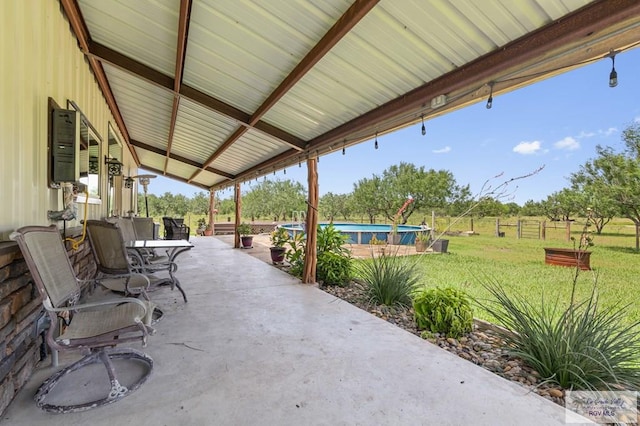 25096 Rabb Rd, La Feria, TX 78559 - view of patio / terrace featuring an outdoor pool