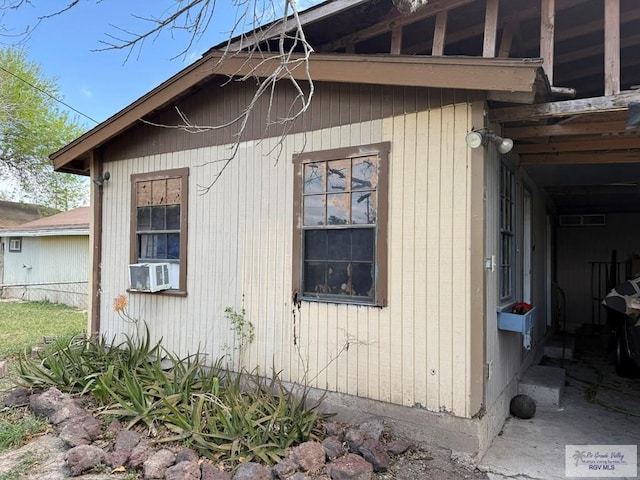 view of side of property featuring cooling unit