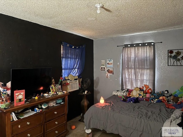 carpeted bedroom with cooling unit, a textured wall, and a textured ceiling