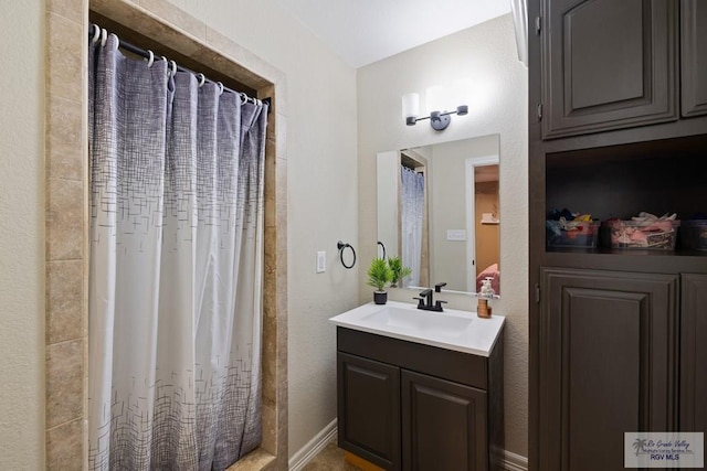 313 Scarlett Cir, Harlingen, TX 78552 - full bathroom featuring vanity and a shower with curtain