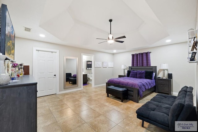 313 Scarlett Cir, Harlingen, TX 78552 - bedroom featuring a raised ceiling, recessed lighting, light tile patterned flooring, ceiling fan, and ensuite bathroom