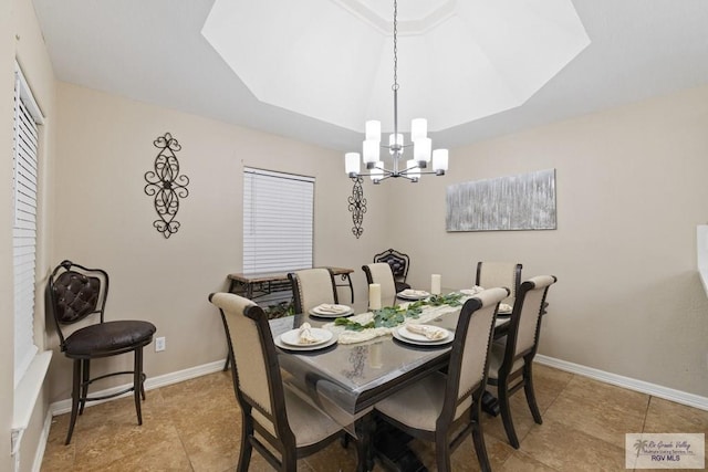 313 Scarlett Cir, Harlingen, TX 78552 - dining area featuring a skylight, a chandelier, and light tile patterned flooring