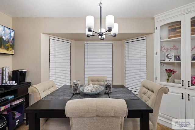 313 Scarlett Cir, Harlingen, TX 78552 - dining area with a chandelier
