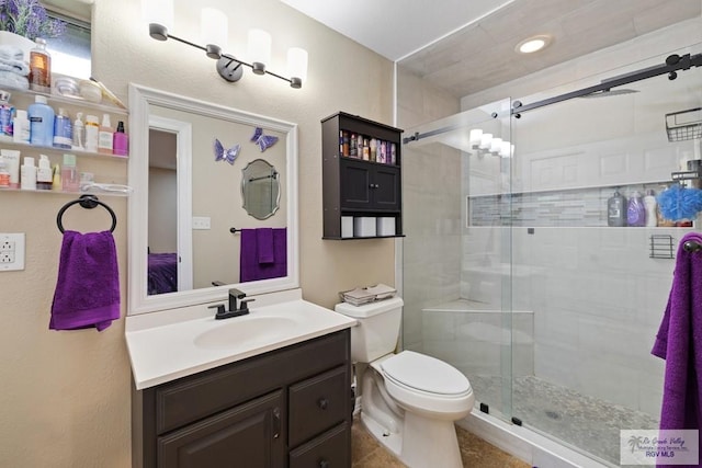 313 Scarlett Cir, Harlingen, TX 78552 - ensuite bathroom featuring a shower stall and vanity