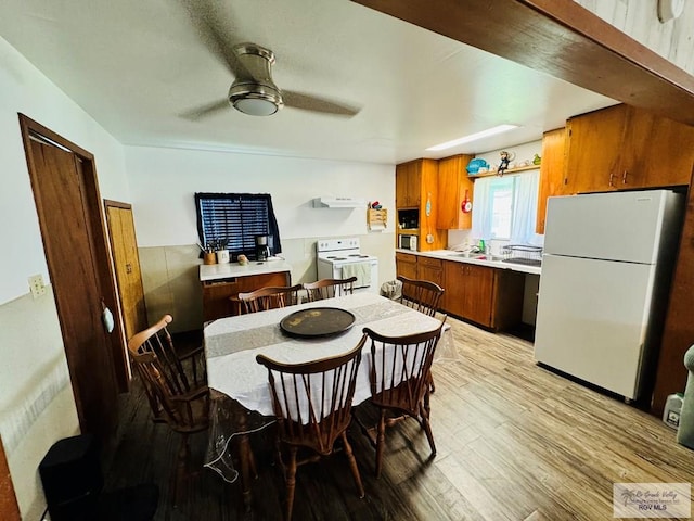 dining area featuring ceiling fan and light hardwood / wood-style flooring