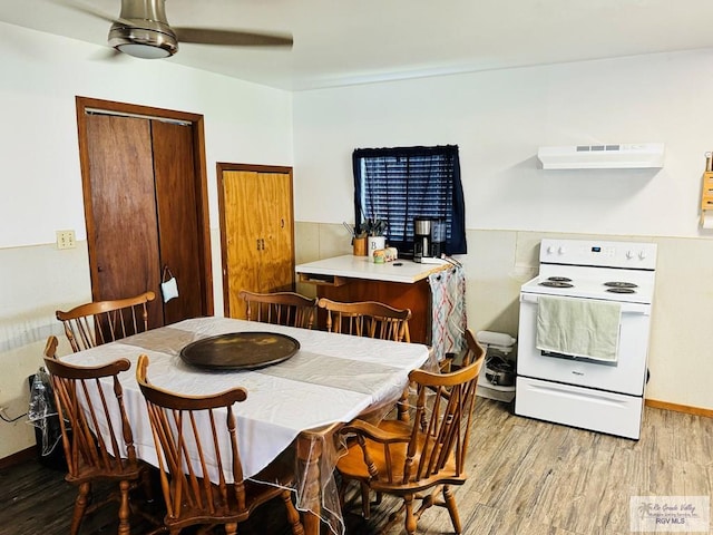 dining area featuring ceiling fan and wood-type flooring