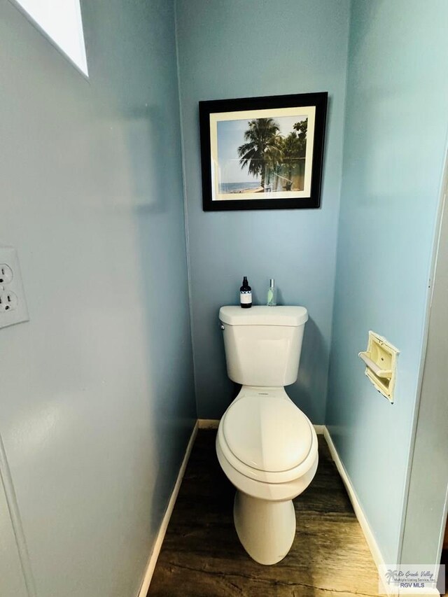 bathroom featuring toilet and hardwood / wood-style flooring