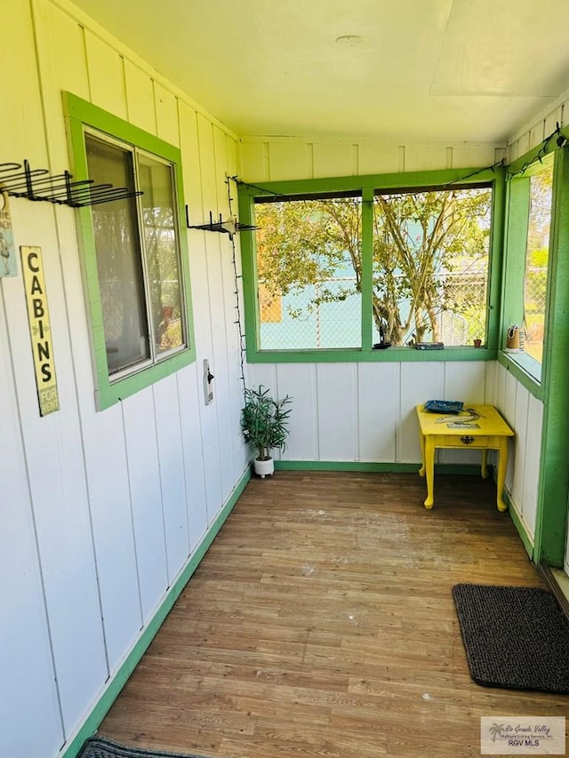 sunroom featuring lofted ceiling