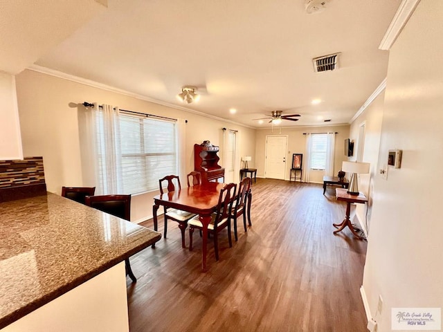 40 Cherokee Ave, Harlingen, TX 78552 - dining space featuring dark wood finished floors, crown molding, a ceiling fan, and recessed lighting