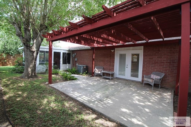 40 Cherokee Ave, Harlingen, TX 78552 - view of patio featuring a pergola and french doors