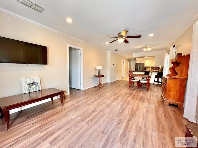 40 Cherokee Ave, Harlingen, TX 78552 - living room with ornamental molding, ceiling fan, light wood-type flooring, and recessed lighting