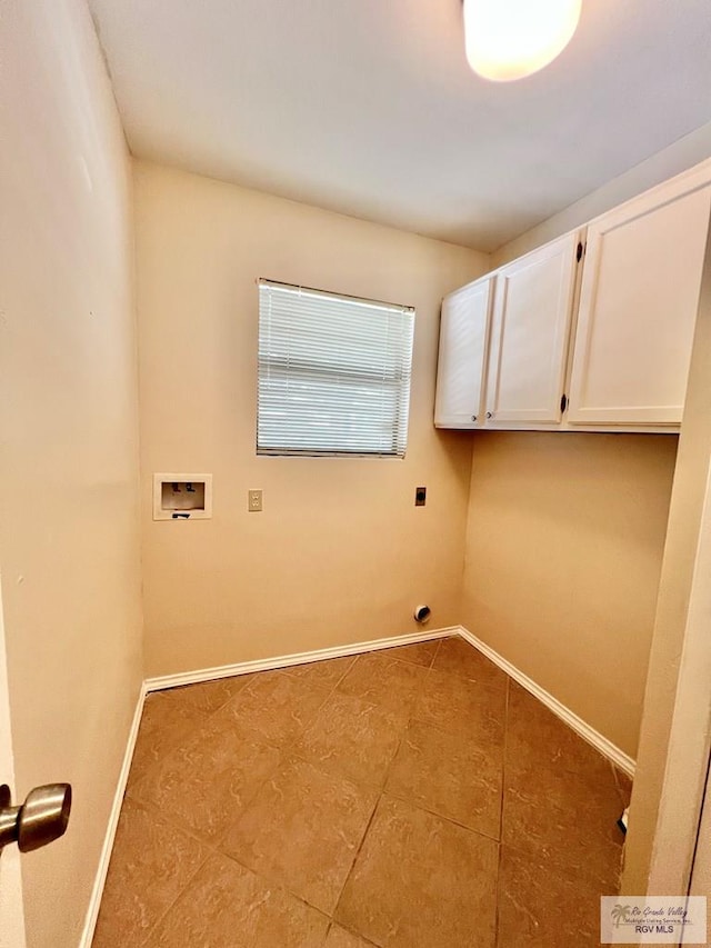 40 Cherokee Ave, Harlingen, TX 78552 - washroom with cabinet space, washer hookup, hookup for an electric dryer, and tile patterned floors