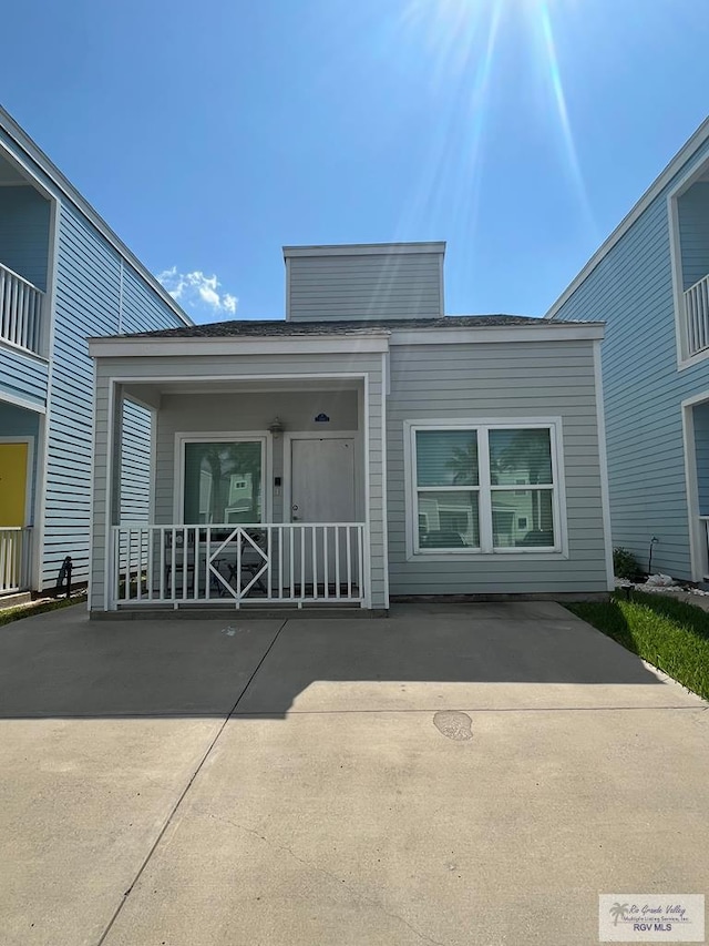 doorway to property featuring covered porch